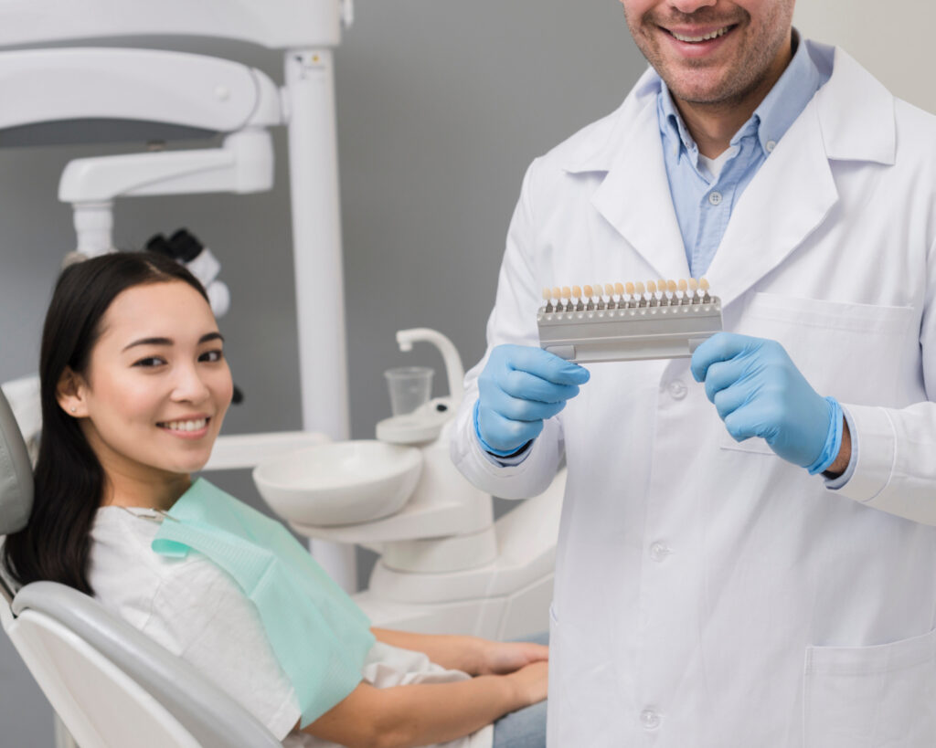 Patient smiling after a cosmetic bonding procedure to repair a chipped tooth.